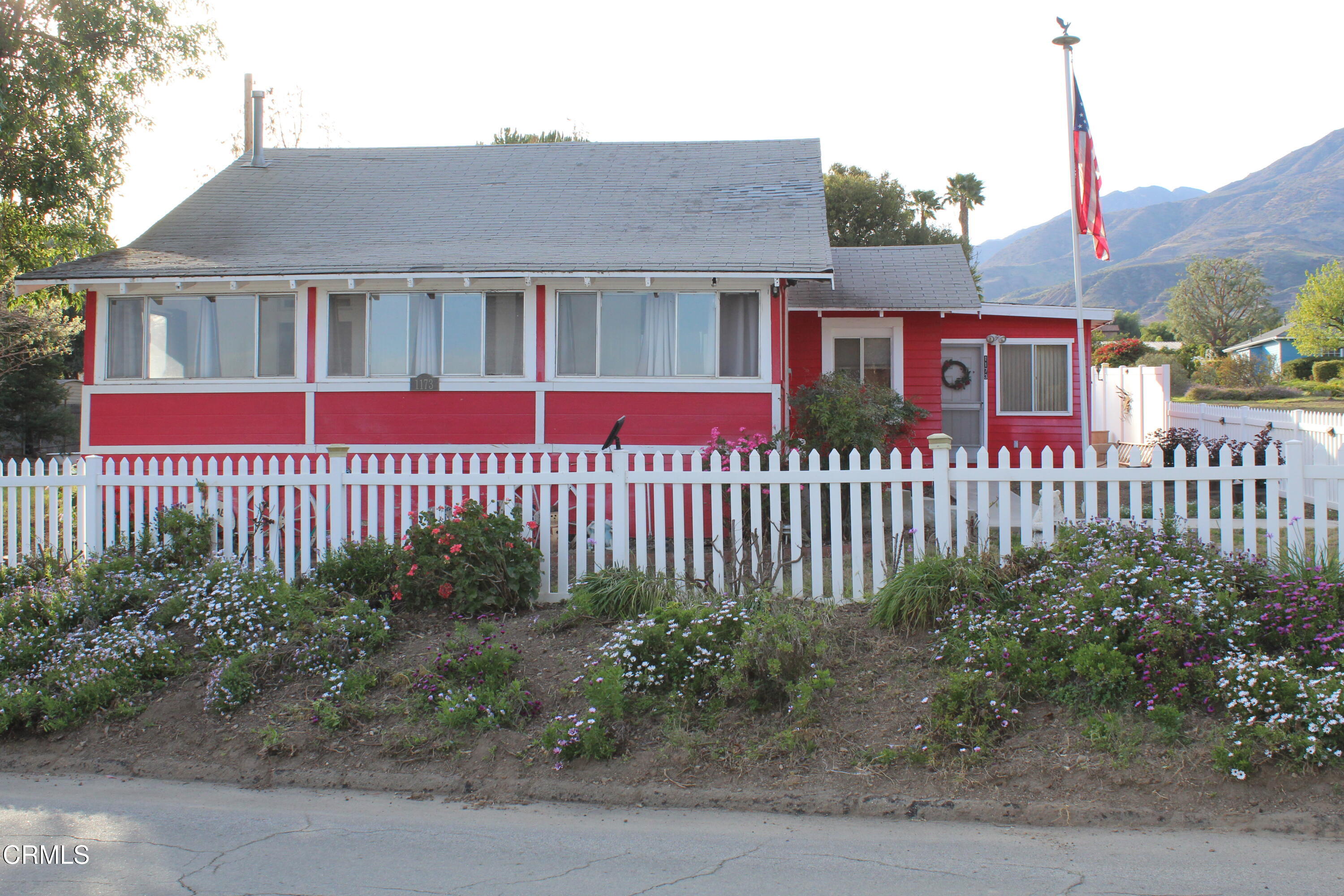 1173 Cliff Avenue Fillmore, CA 93015 - Photo 2 of 8 a front view of a house with a garden