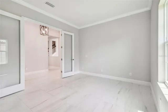 a bathroom with a granite countertop sink a mirror and a vanity
