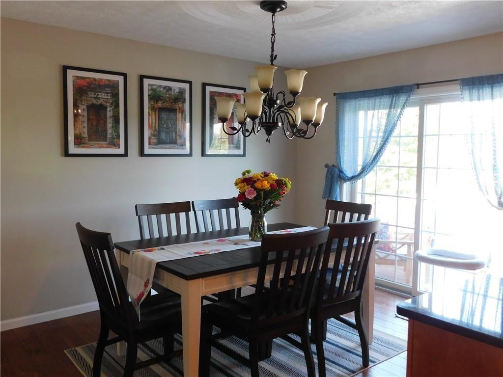 309 Shagbark Road Grindstone, PA 15442 - Photo 15 of 45 a dining room with furniture a livingroom and chandelier