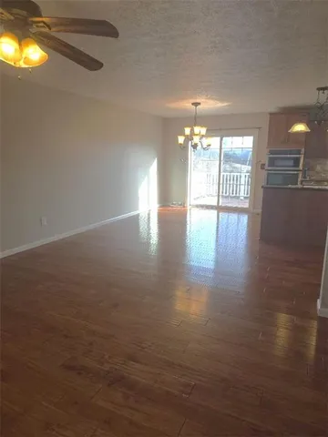 a view of livingroom and hardwood floor