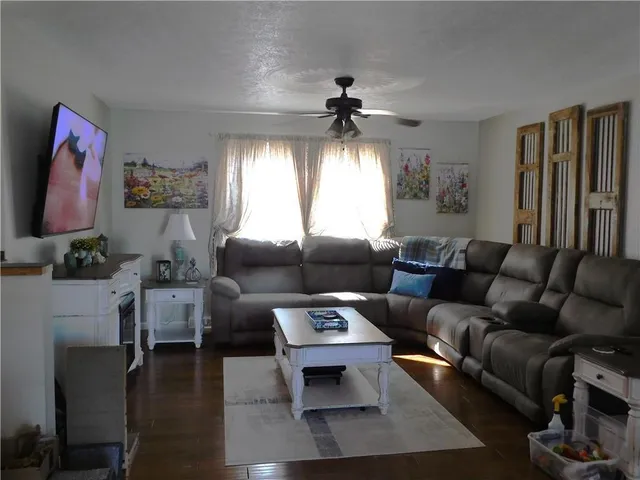 a living room with furniture and a window
