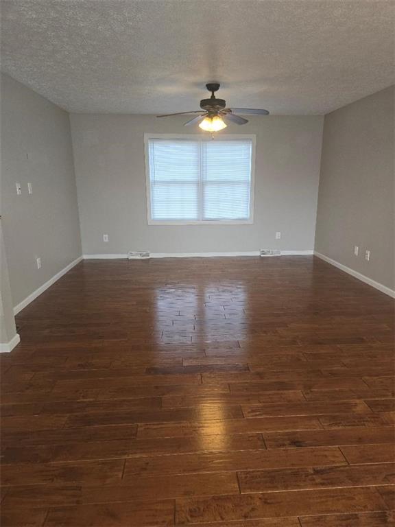 309 Shagbark Road Grindstone, PA 15442 - Photo 18 of 45 a view of an empty room with wooden floor and a window