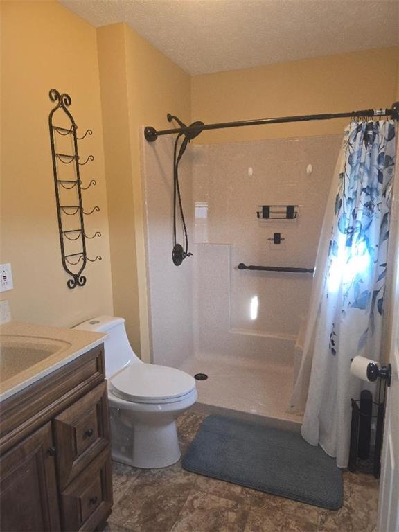 309 Shagbark Road Grindstone, PA 15442 - Photo 21 of 45 a bathroom with a shower toilet and sink