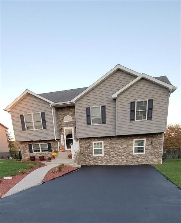 309 Shagbark Road Grindstone, PA 15442 - Photo 3 of 45 a front view of a house with a yard