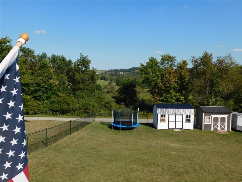 309 Shagbark Road Grindstone, PA 15442 - Photo 39 of 45 a house view with a garden space