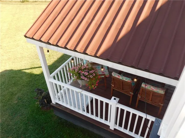a view of balcony with wooden floor