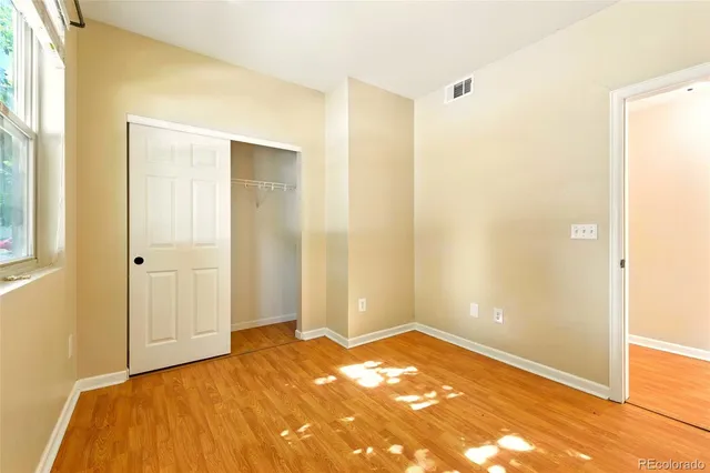 a view of a room with a wooden floor