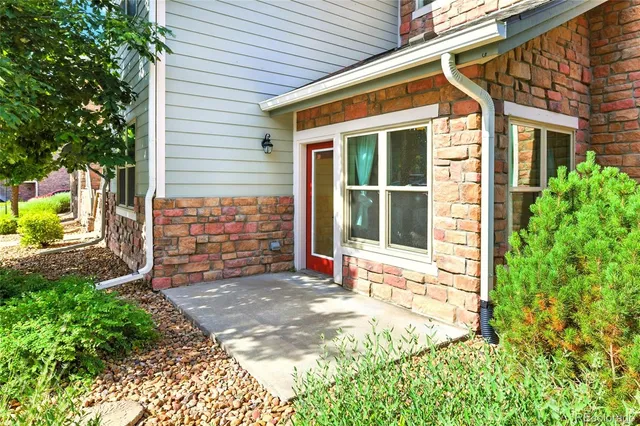 a view of house with backyard and garden