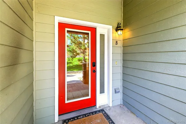 a view of front door and bedroom