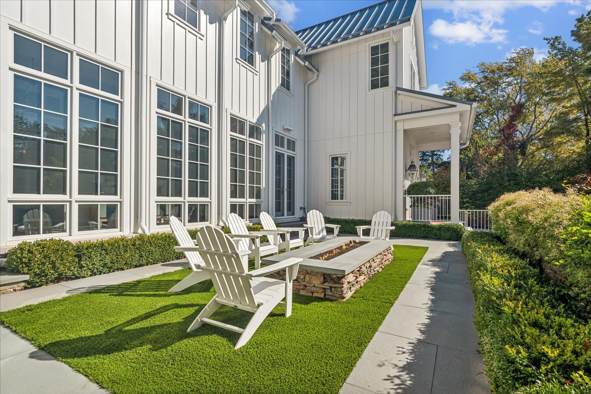 973 Sheridan Road Winnetka, IL 60093 - Photo 16 of 92 a view of a house with backyard sitting area and garden