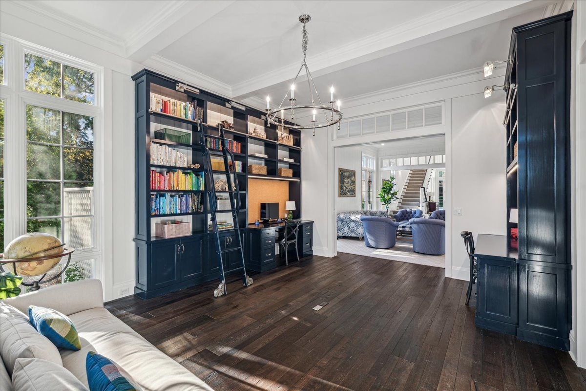 973 Sheridan Road Winnetka, IL 60093 - Photo 24 of 92 a living room with furniture lots of books and a dining table