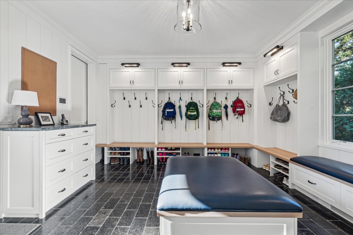 973 Sheridan Road Winnetka, IL 60093 - Photo 46 of 92 a living room with stainless steel appliances kitchen island granite countertop a sink dishwasher and white cabinets with wooden floor