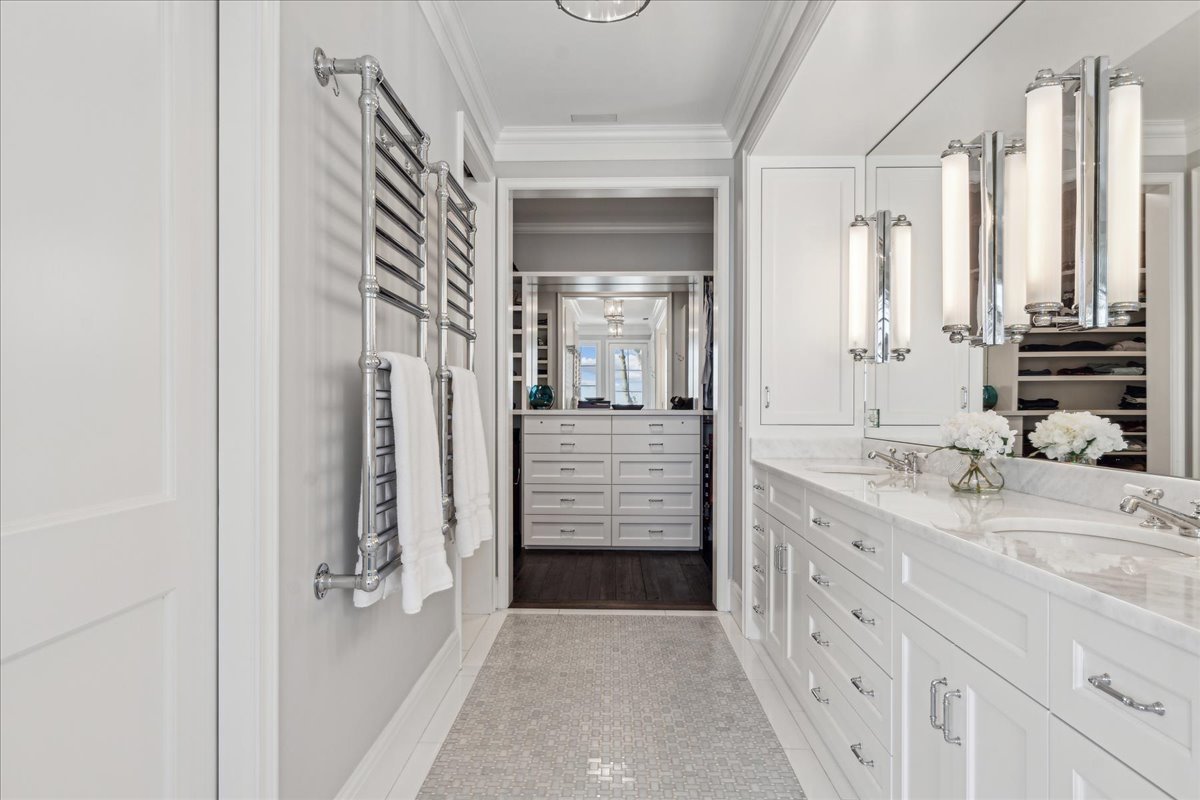 973 Sheridan Road Winnetka, IL 60093 - Photo 58 of 92 a bathroom with a double vanity sink a vanity and a mirror