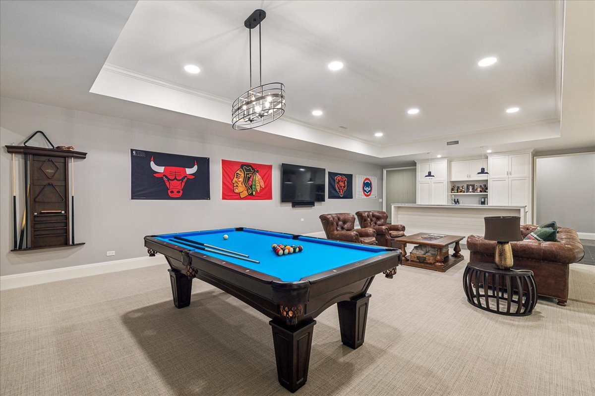 973 Sheridan Road Winnetka, IL 60093 - Photo 77 of 92 a room with furniture pool table and a chandelier