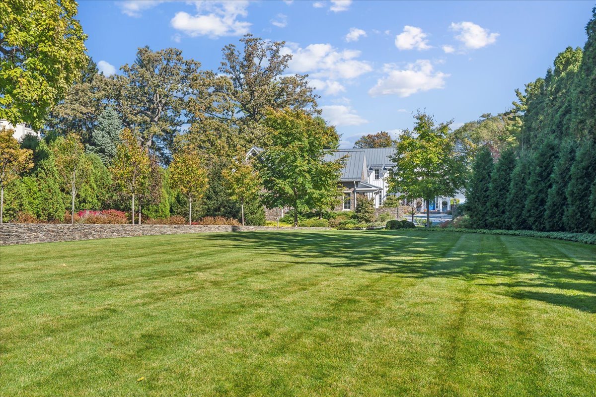 973 Sheridan Road Winnetka, IL 60093 - Photo 8 of 92 a view of a grassy field with trees