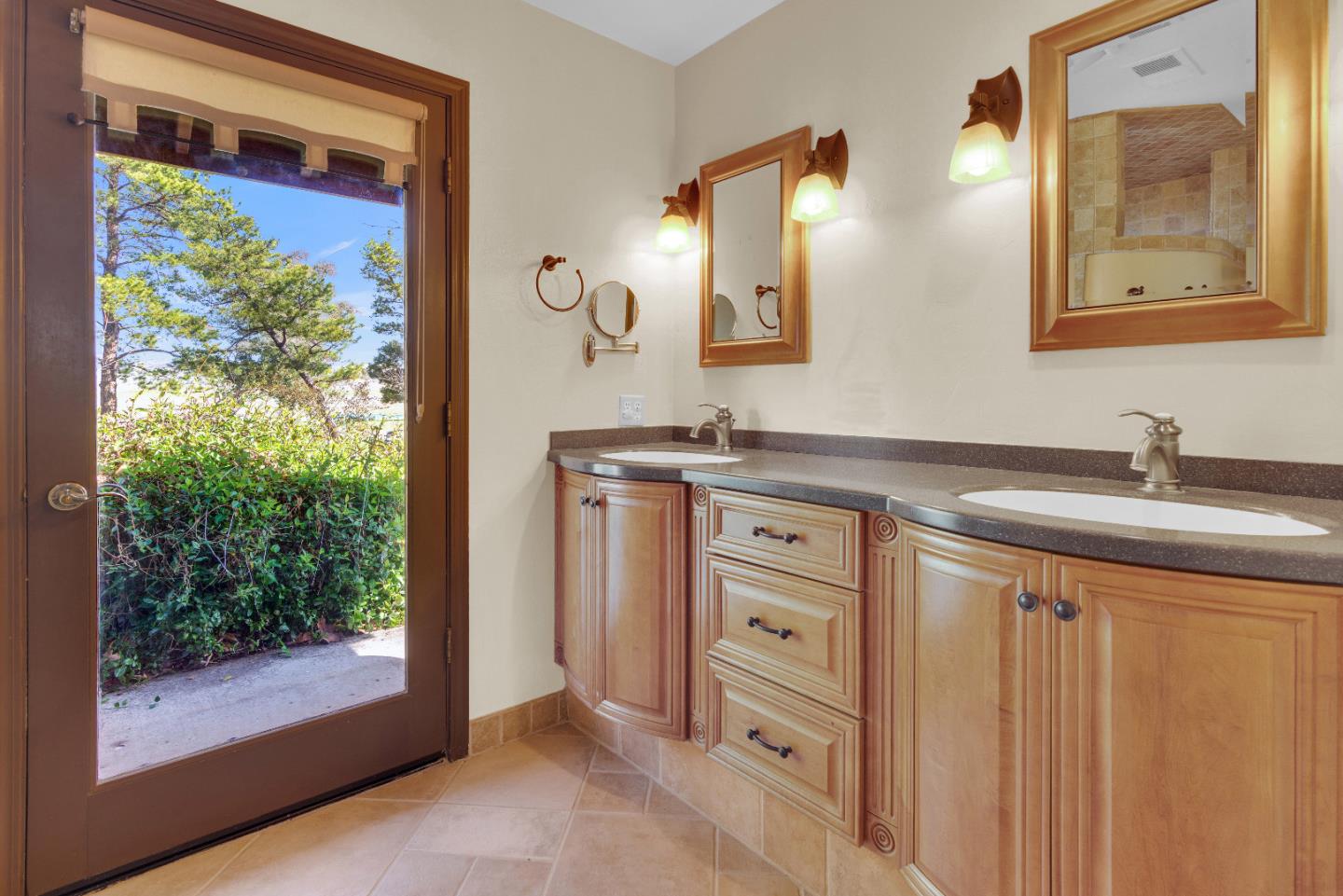 50145 Adobe Place Bradley, CA 93426 - Photo 19 of 39 a bathroom with a double vanity sink mirror and shower