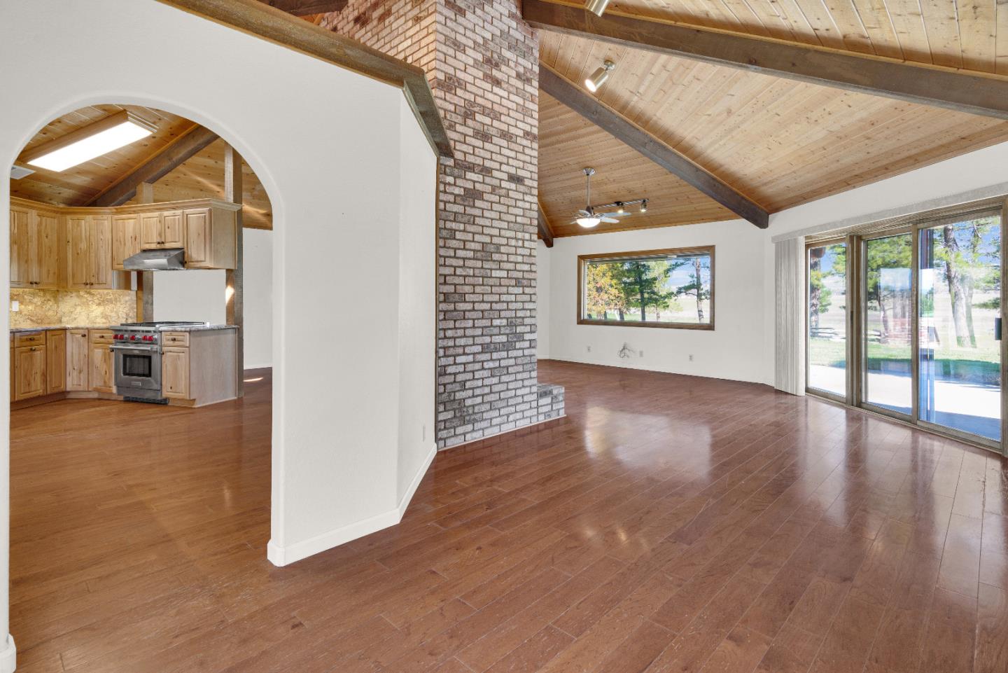 50145 Adobe Place Bradley, CA 93426 - Photo 8 of 39 an empty room with wooden floor and windows
