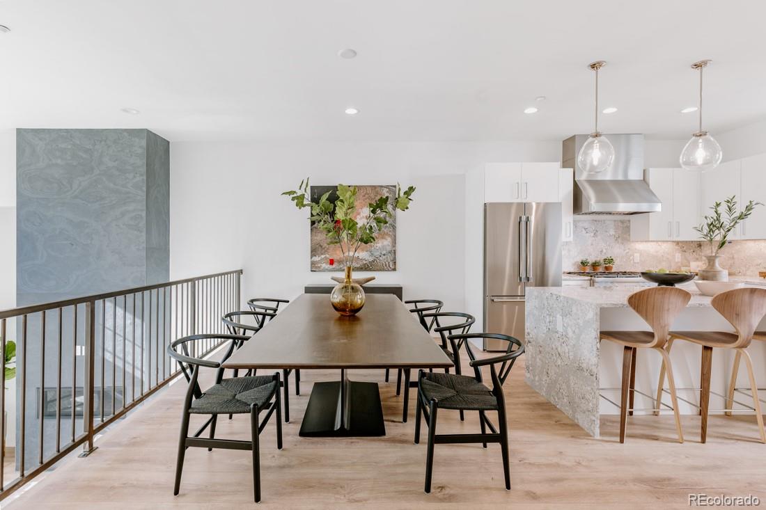 838 Ash Street, Unit 6 Denver, CO 80220 - Photo 13 of 40 a view of a dining room with furniture and a chandelier