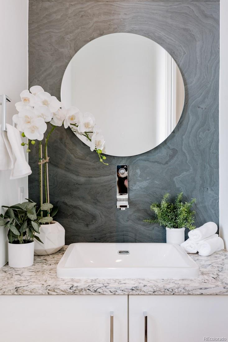 838 Ash Street, Unit 6 Denver, CO 80220 - Photo 16 of 40 a bathroom with a granite countertop sink and a mirror