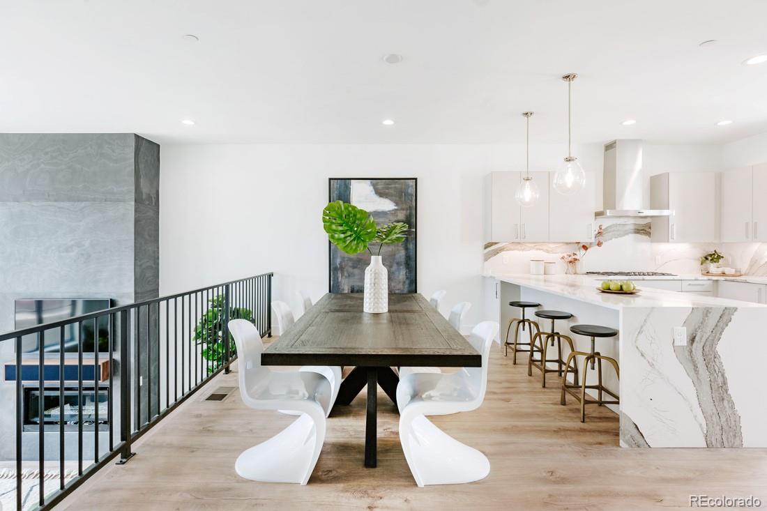 838 Ash Street, Unit 6 Denver, CO 80220 - Photo 20 of 40 a living room with furniture a rug potted plant and kitchen view