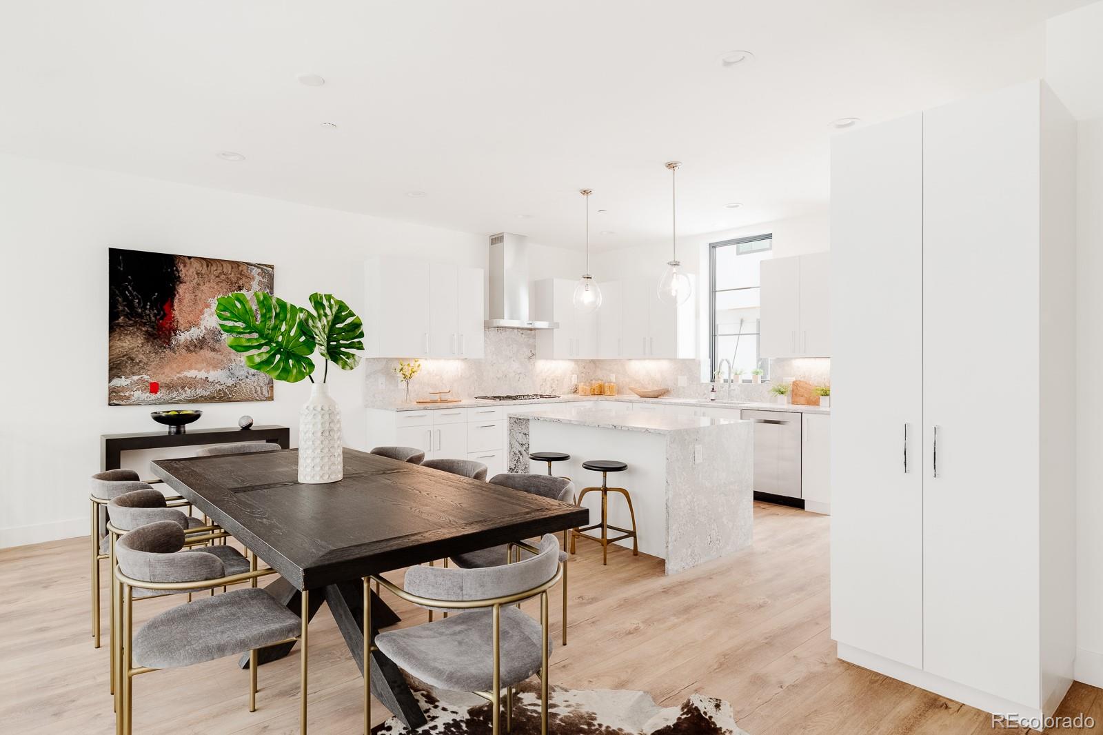 838 Ash Street, Unit 6 Denver, CO 80220 - Photo 2 of 40 a kitchen with a table and chairs in it