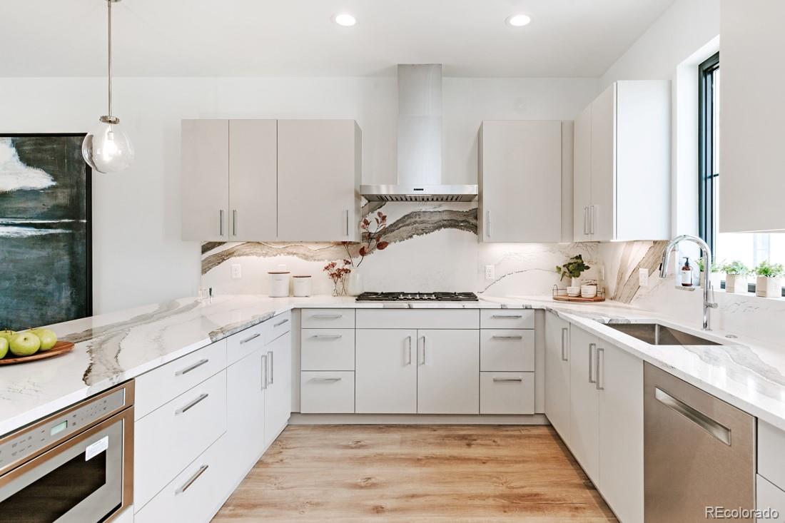838 Ash Street, Unit 6 Denver, CO 80220 - Photo 21 of 40 a kitchen with a sink stove and cabinets