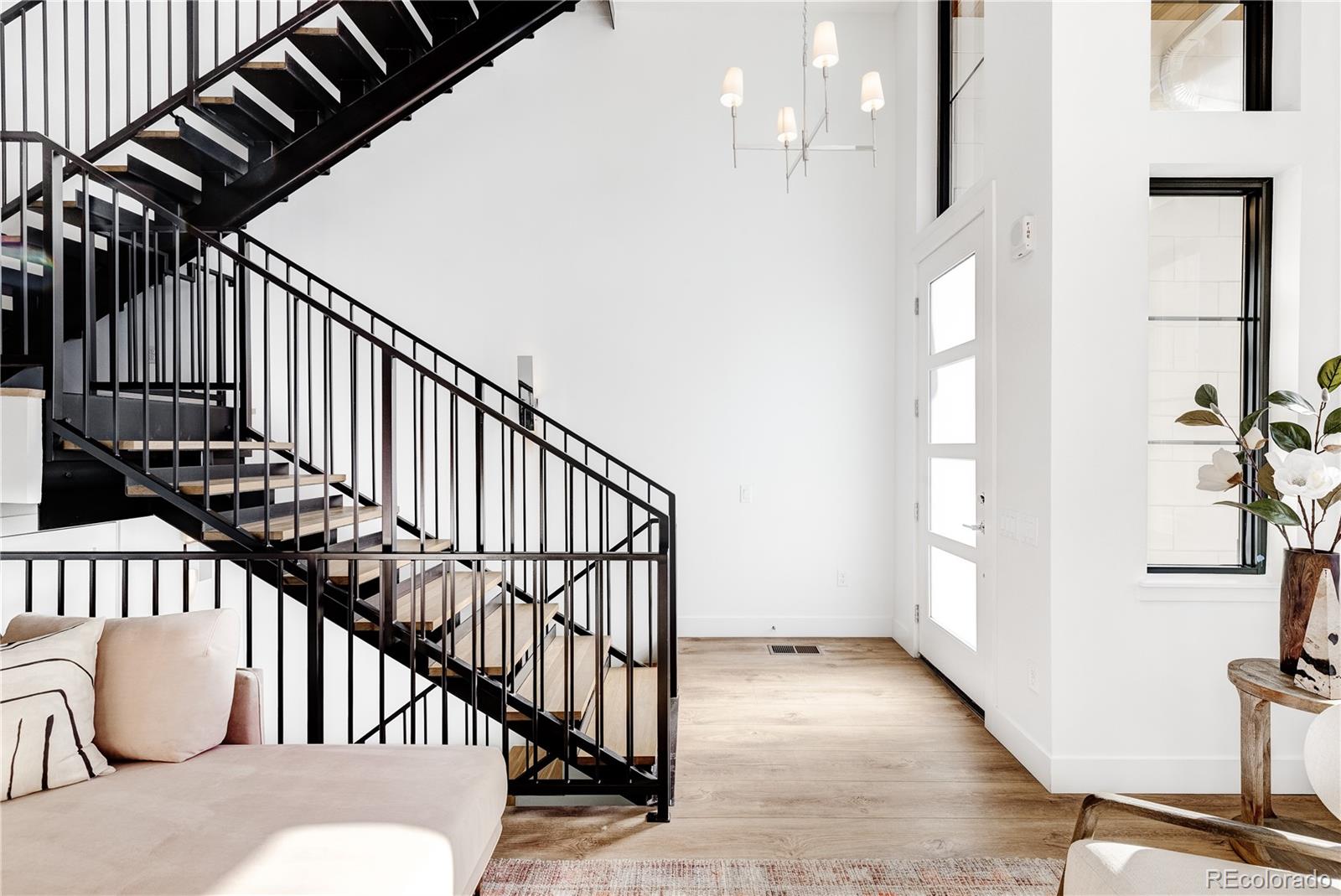 838 Ash Street, Unit 6 Denver, CO 80220 - Photo 24 of 40 a view of entryway and hall with wooden floor