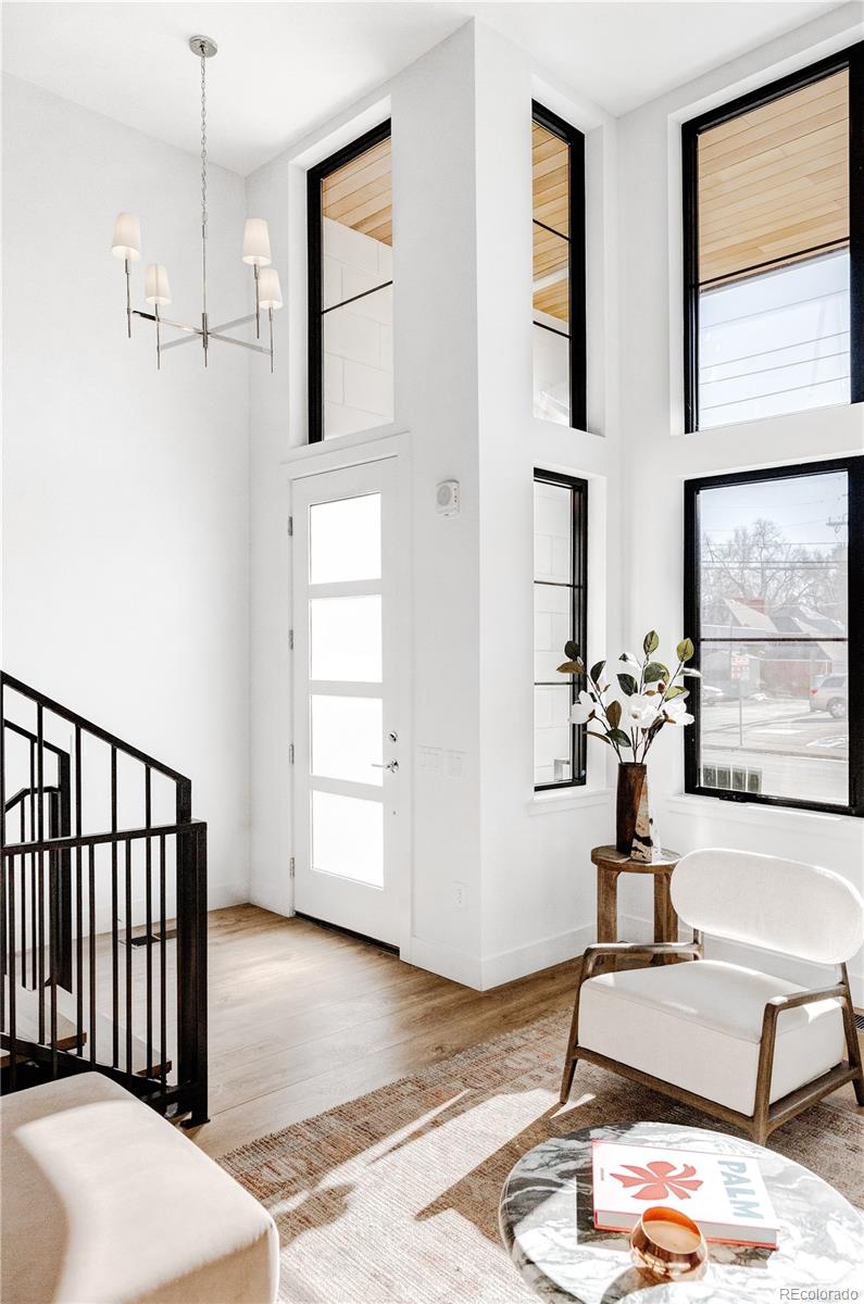 838 Ash Street, Unit 6 Denver, CO 80220 - Photo 25 of 40 a view of a livingroom with furniture and windows