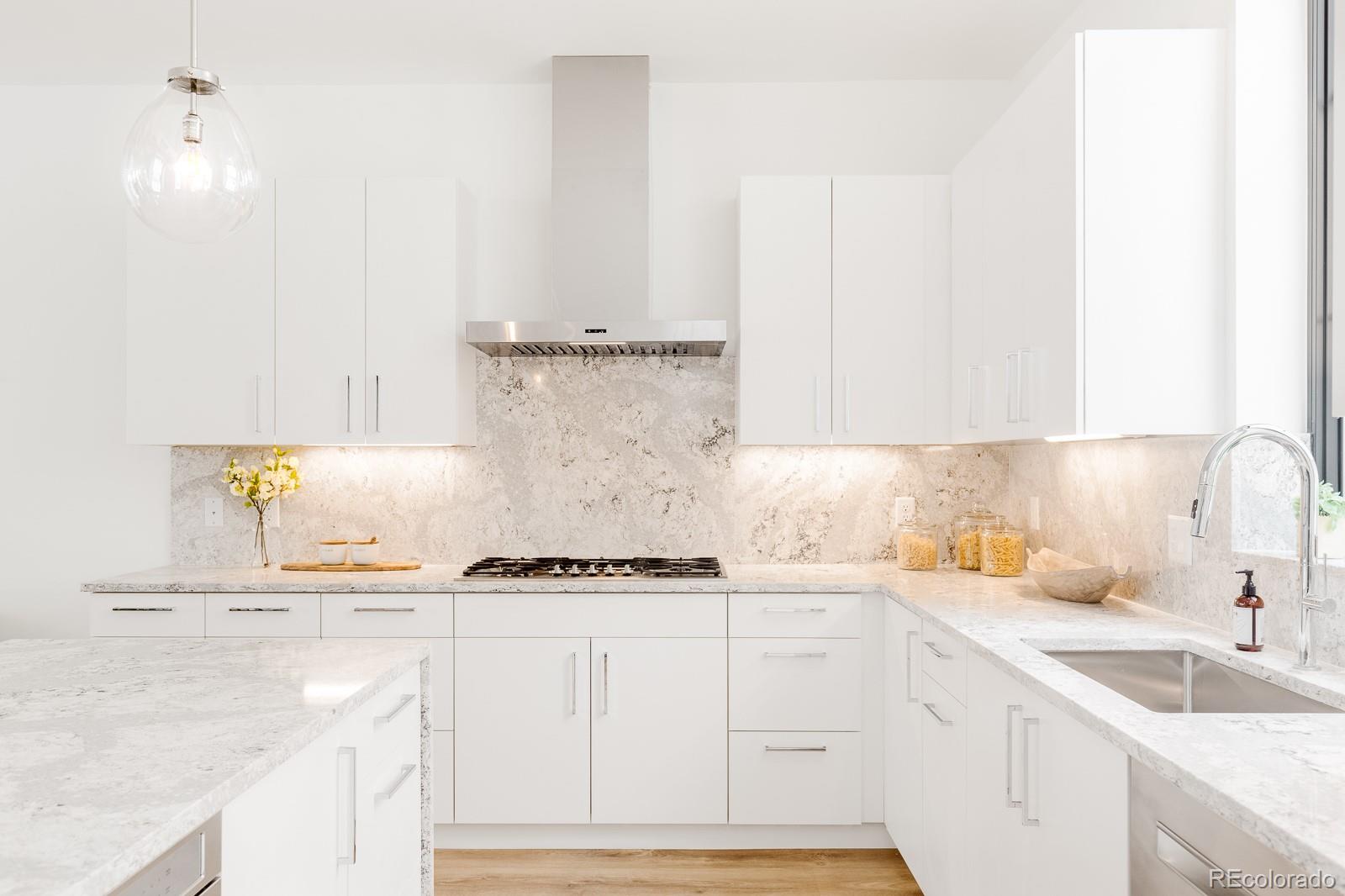 838 Ash Street, Unit 6 Denver, CO 80220 - Photo 3 of 40 a kitchen with granite countertop a sink and a stove