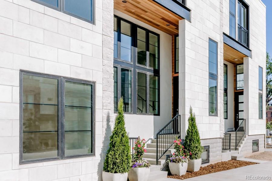 838 Ash Street, Unit 6 Denver, CO 80220 - Photo 34 of 40 front view of a brick house with a potted plant