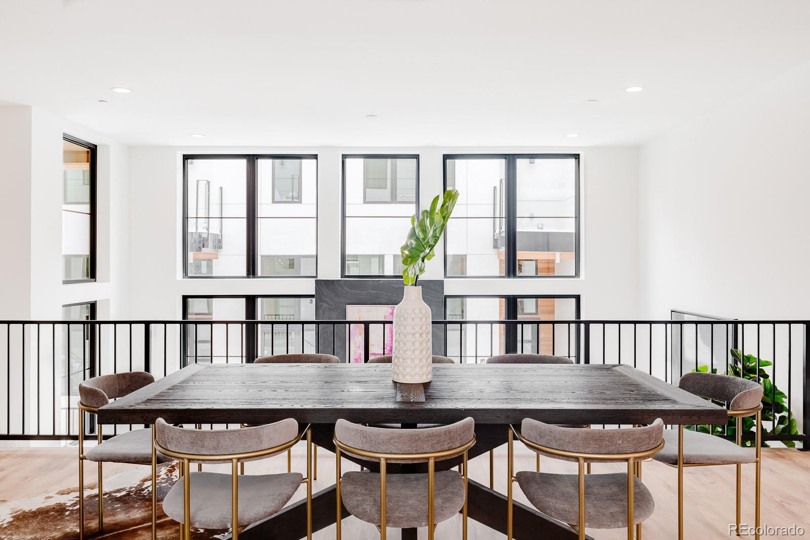838 Ash Street, Unit 6 Denver, CO 80220 - Photo 4 of 40 a view of a dining room with furniture window and wooden floor