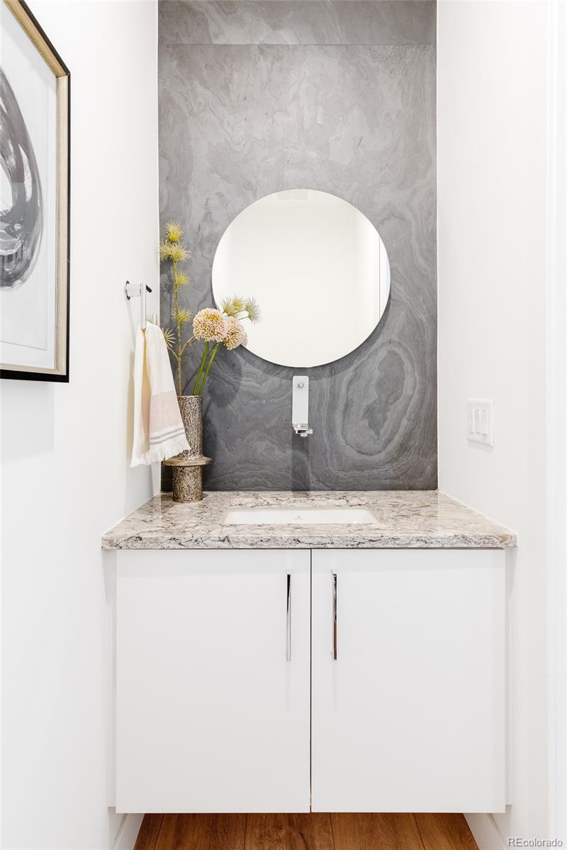 838 Ash Street, Unit 6 Denver, CO 80220 - Photo 5 of 40 a bathroom with a granite countertop sink and a mirror