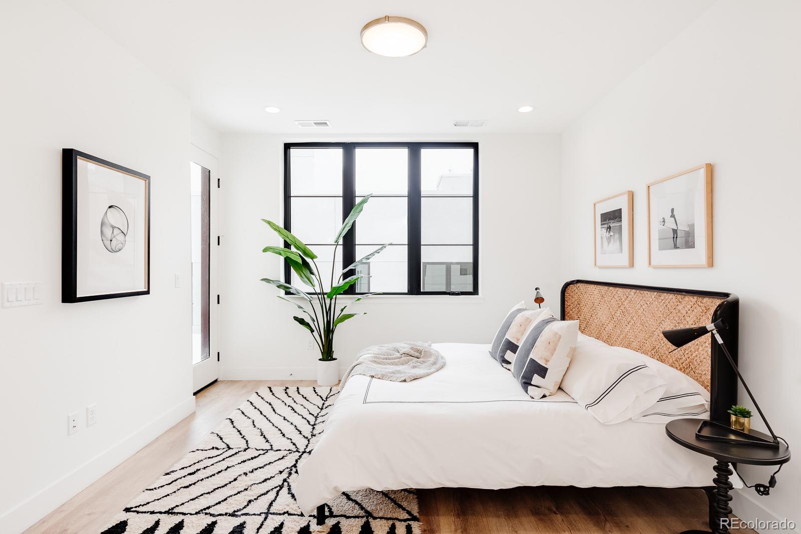 838 Ash Street, Unit 6 Denver, CO 80220 - Photo 6 of 40 a bedroom with a bed and a window