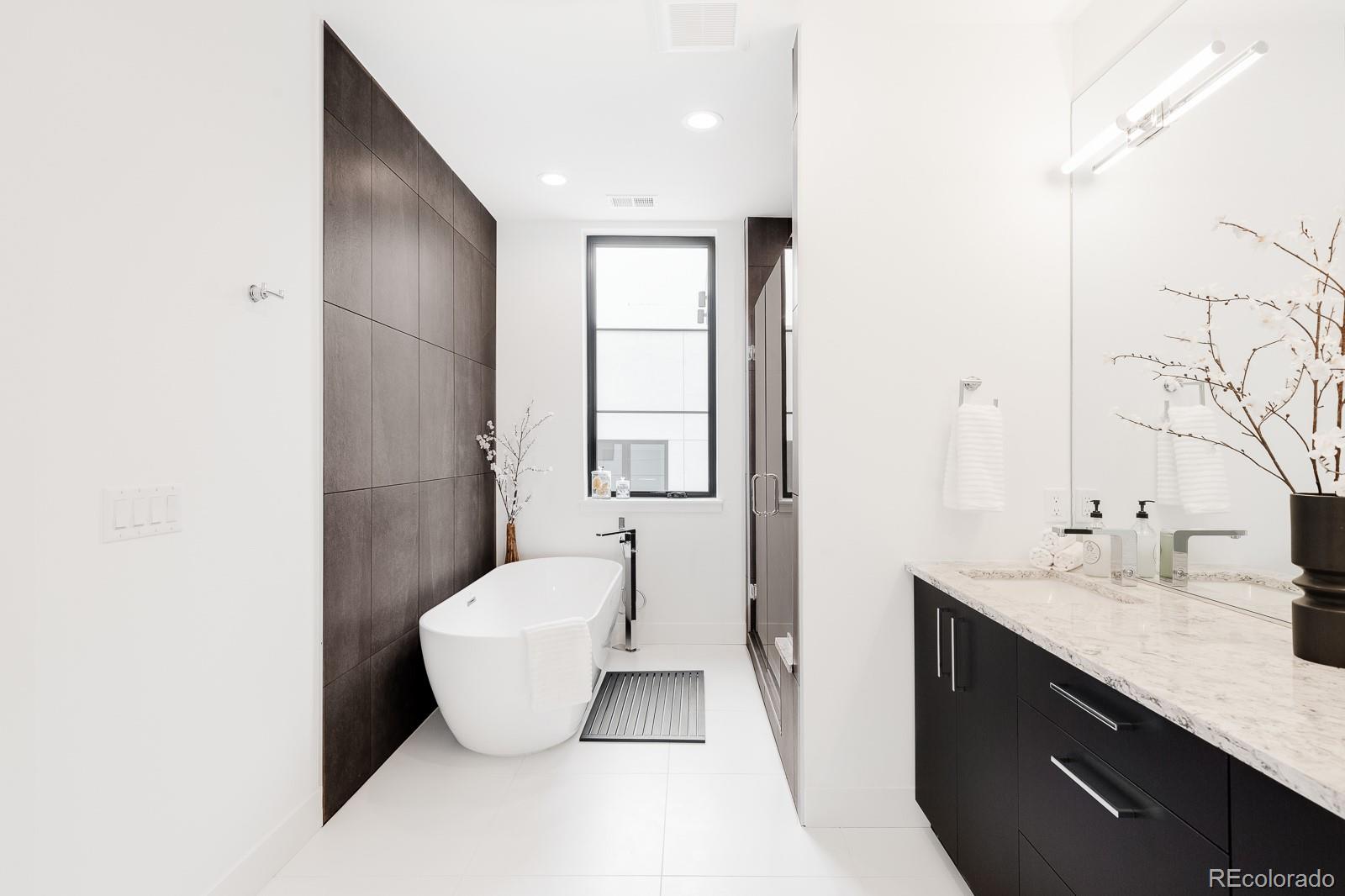 838 Ash Street, Unit 6 Denver, CO 80220 - Photo 7 of 40 a bathroom with a sink and a mirror