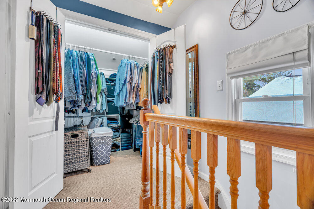 51 Dock Road Brick, NJ 08723 - Photo 40 of 57 a view of walk in closet with clothes and shoes