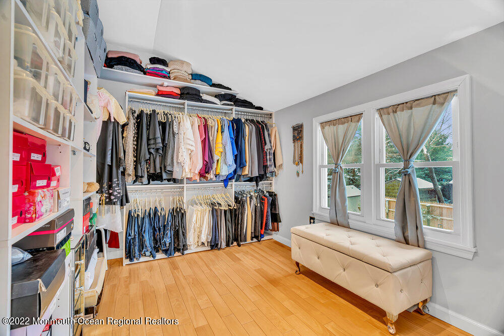 51 Dock Road Brick, NJ 08723 - Photo 42 of 57 a view of walk in closet with clothes and shoes