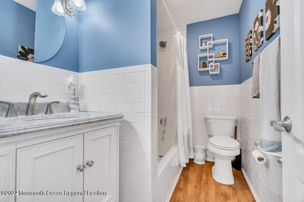 51 Dock Road Brick, NJ 08723 - Photo 44 of 57 a bathroom with a toilet sink and mirror