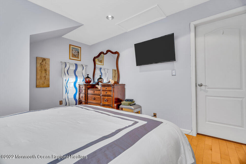 51 Dock Road Brick, NJ 08723 - Photo 48 of 57 a bedroom with a bed and a flat screen tv