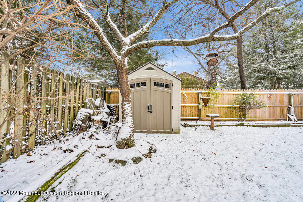 51 Dock Road Brick, NJ 08723 - Photo 53 of 57 a view of a backyard with a large tree