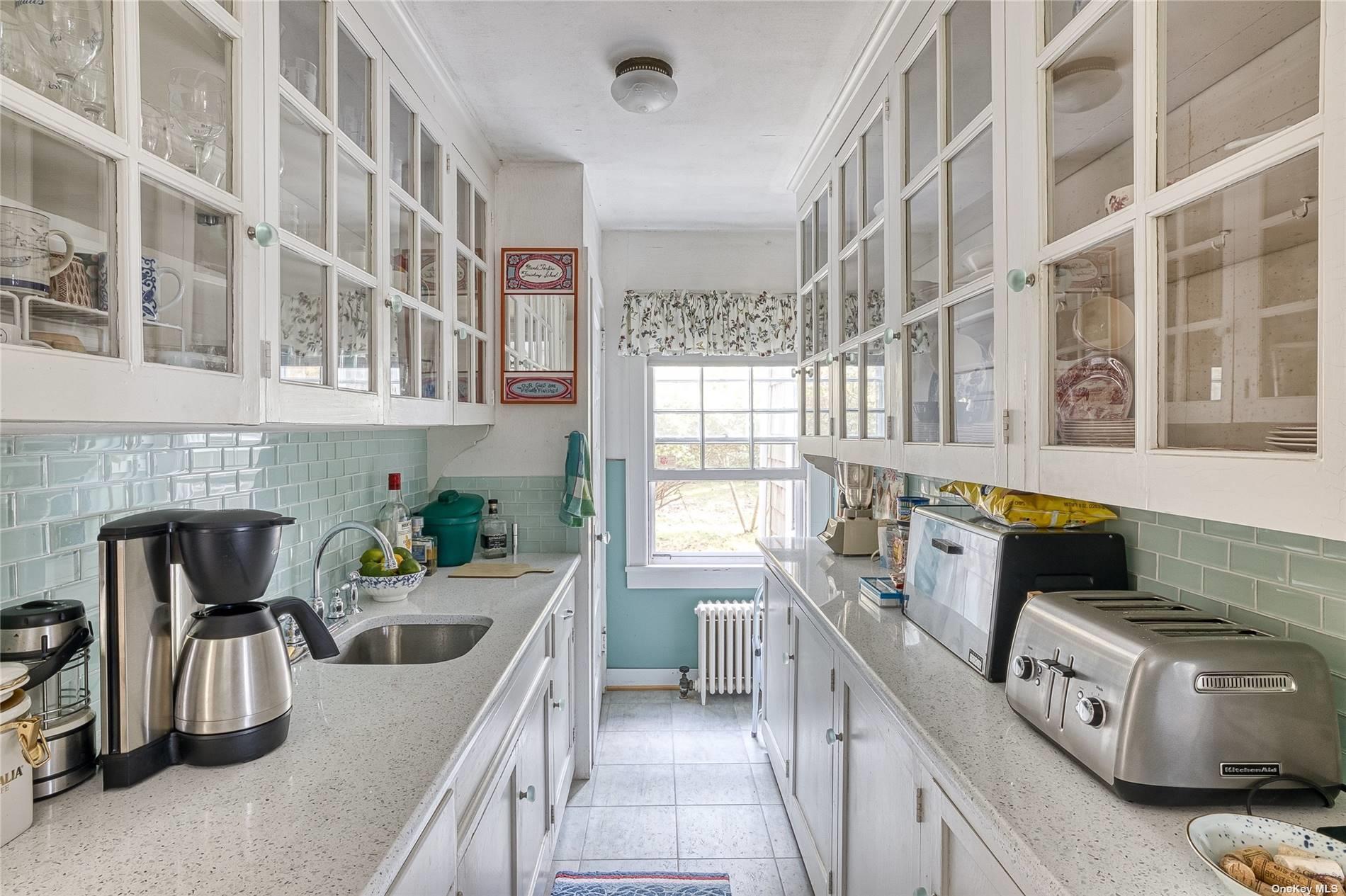 1695 Old Wood Path Southold, NY 11971 - Photo 11 of 32 a kitchen with stainless steel appliances granite countertop a stove and a sink