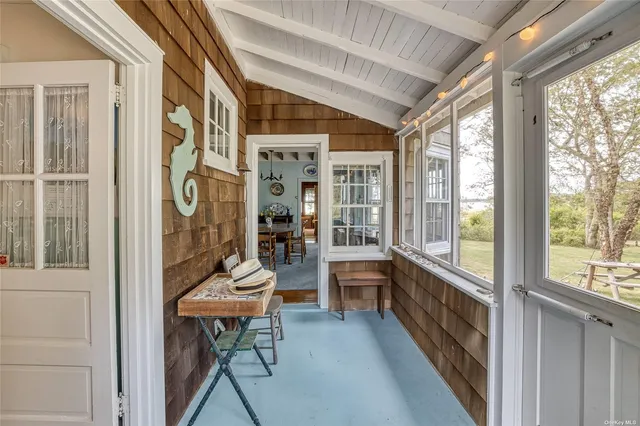 a room with furniture and large windows