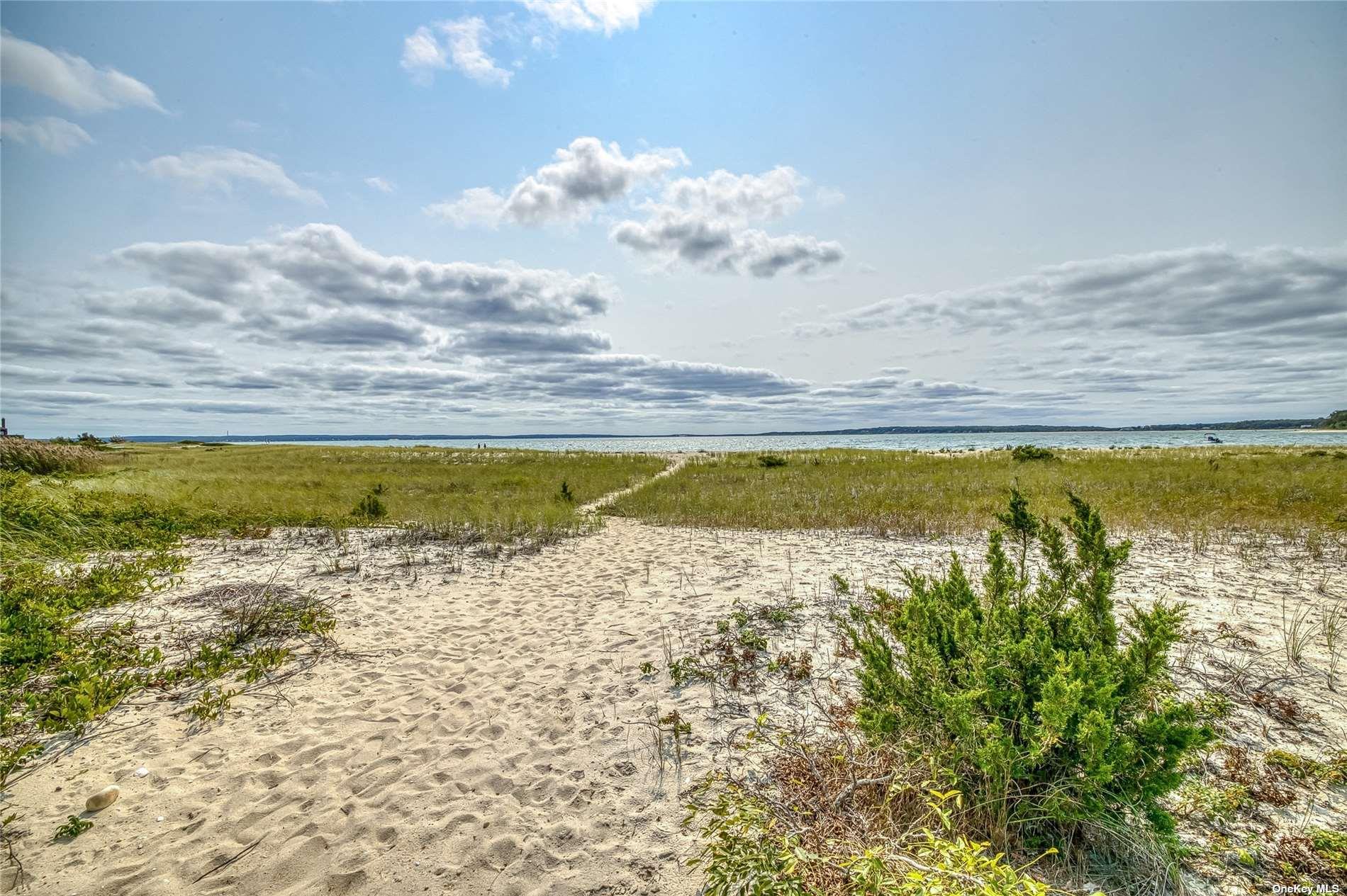 1695 Old Wood Path Southold, NY 11971 - Photo 30 of 32 a view of a swimming pool and an ocean view