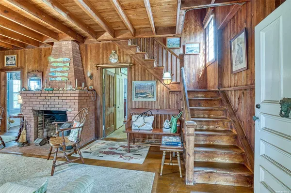 a view of a livingroom with furniture staircase and a living room