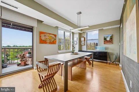 a view of a dining room with furniture and a table