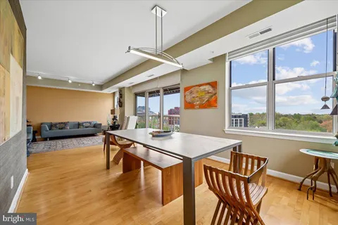a view of a chairs and table in a balcony