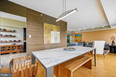 a kitchen with stainless steel appliances granite countertop a refrigerator a stove and a sink