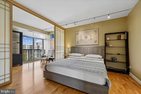 a bedroom with a bed and a table