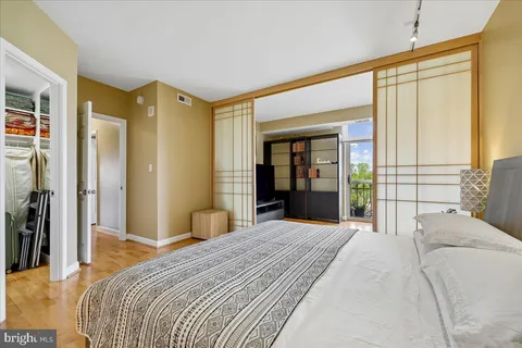 a view of a room with furniture and a window