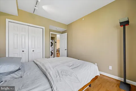 a view of a chair and table in backyard of the house