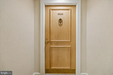 a bathroom with a glass door shower and a sink